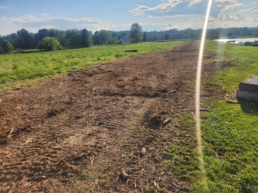Wide cleared strip running between standing timber on a Minford, Ohio property